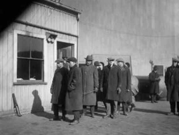 Massachusetts prisoners seized during government raids awaiting transport to Deer Island on January 4, 1920.