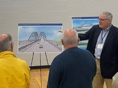 The public looks at design plans during a Cape Cod Bridges meeting.