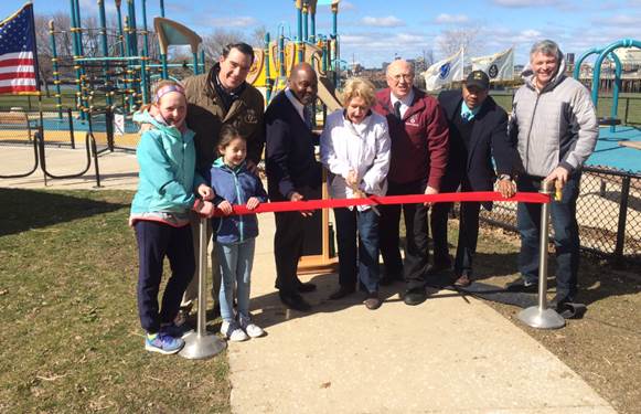 Massachusetts Department of Conservation and Recreation Commissioner Leo Roy and state and local officials celebrate the opening of the Mary O’Malley State Park playground in Chelsea