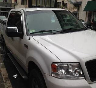 Photo of vehicle displaying a placard observed regularly near a construction site in Boston. According to RMV records, the placard belongs to the mother of the vehicle owner. Despite the vehicle owner receiving a citation for misusing a placard in 2013, the ISAU observed this vehicle throughout the surveillance period.