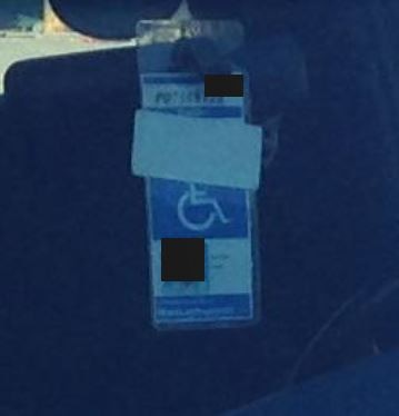 Photo of a placard with the expiration date covered in the Fenway area of Boston, near a construction site. According to RMV records, this placard is expired and belongs to an 81-year-old individual. The vehicle owner is the placard holder’s son.