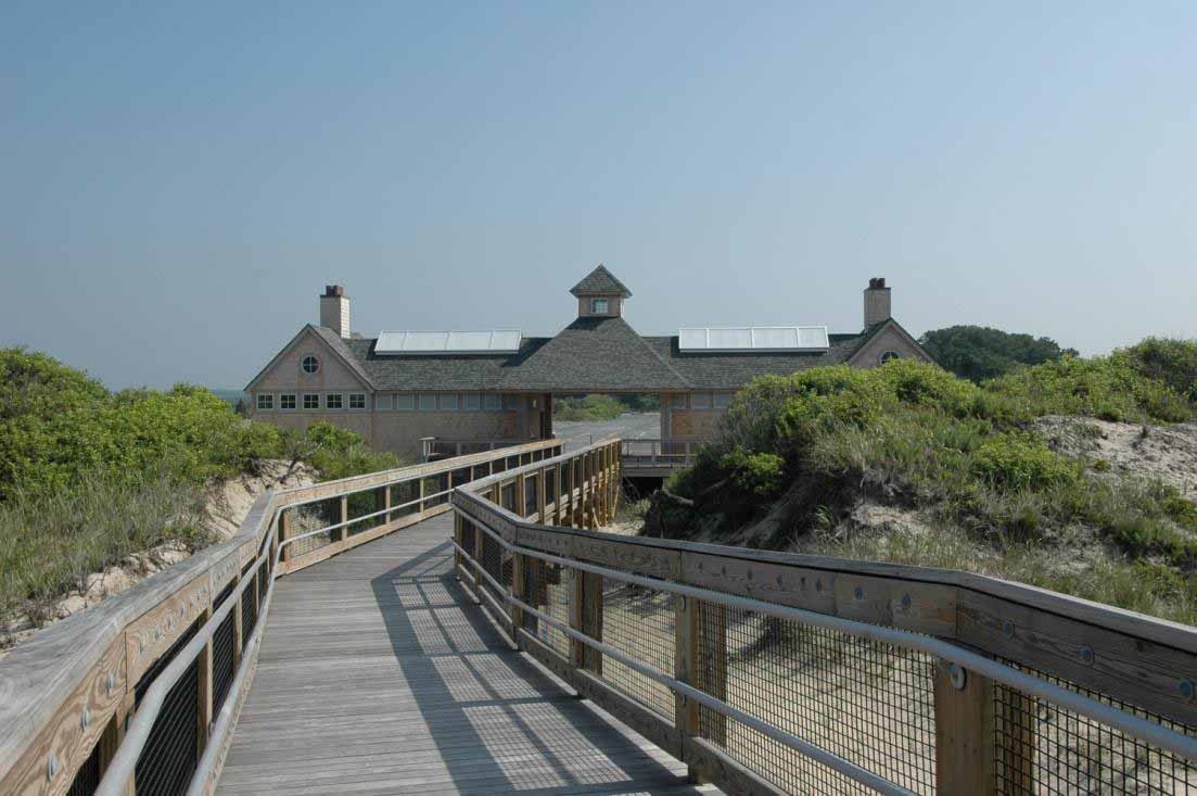Exterior view of a wooden structure at the end of a board walk