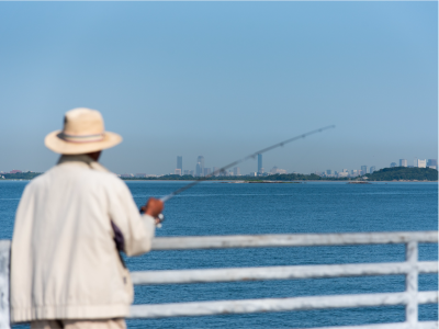 man fishing  on a pier