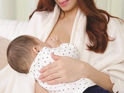 a mom breastfeeding her baby