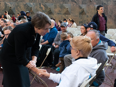 AG Healey shakes hands with someone