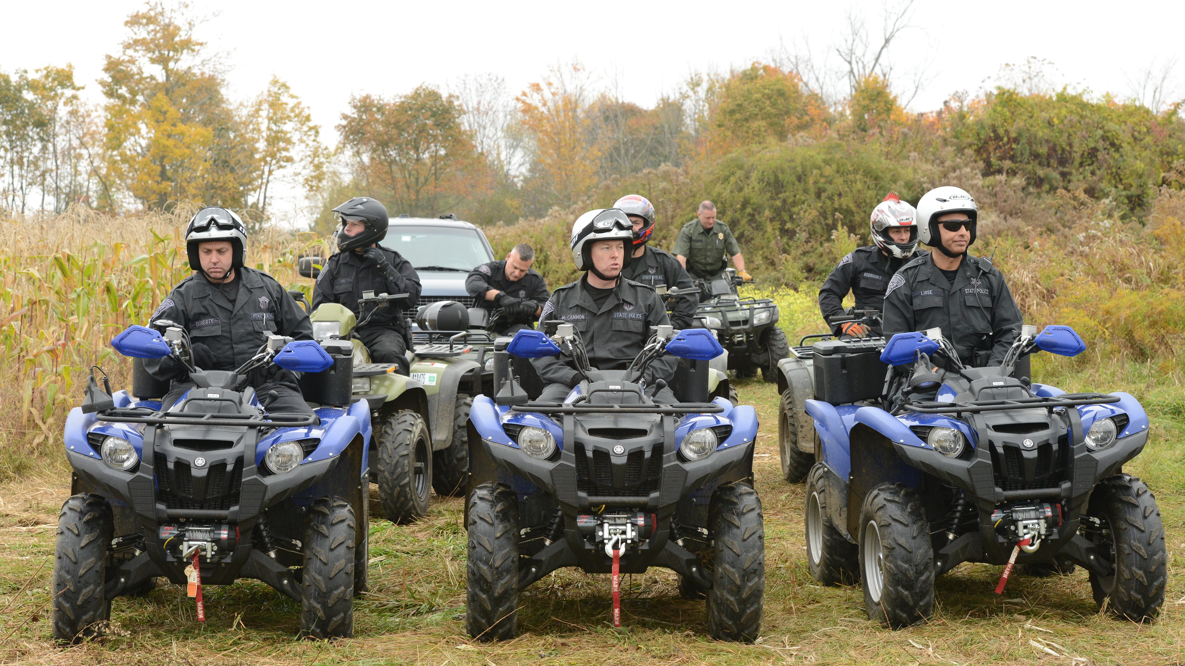 Members of the unit on all-terrain-vehicles (ATVs)