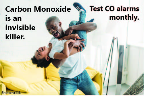 Father and son playing with the text, Carbon Monoxide is an invisible killer. Test CO alarms monthly.