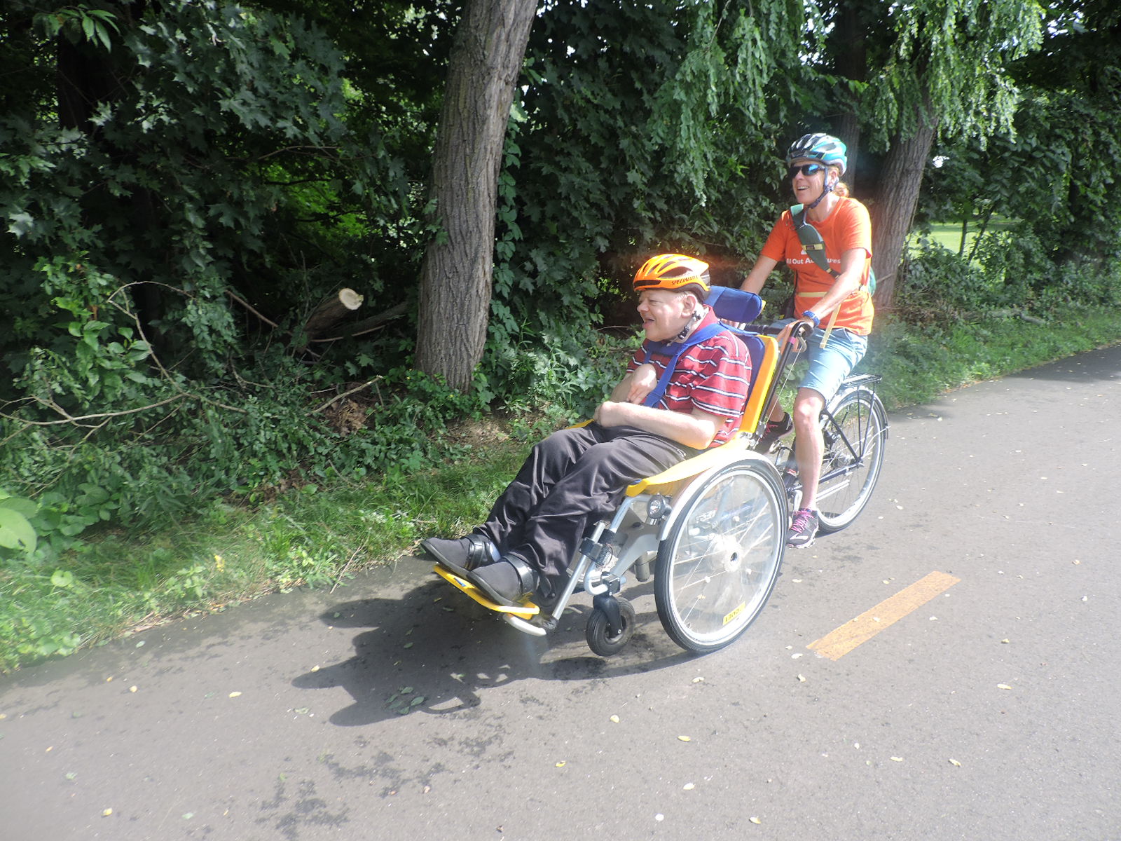 Riders on Duet Bike smiling while riding on the Rail Trail
