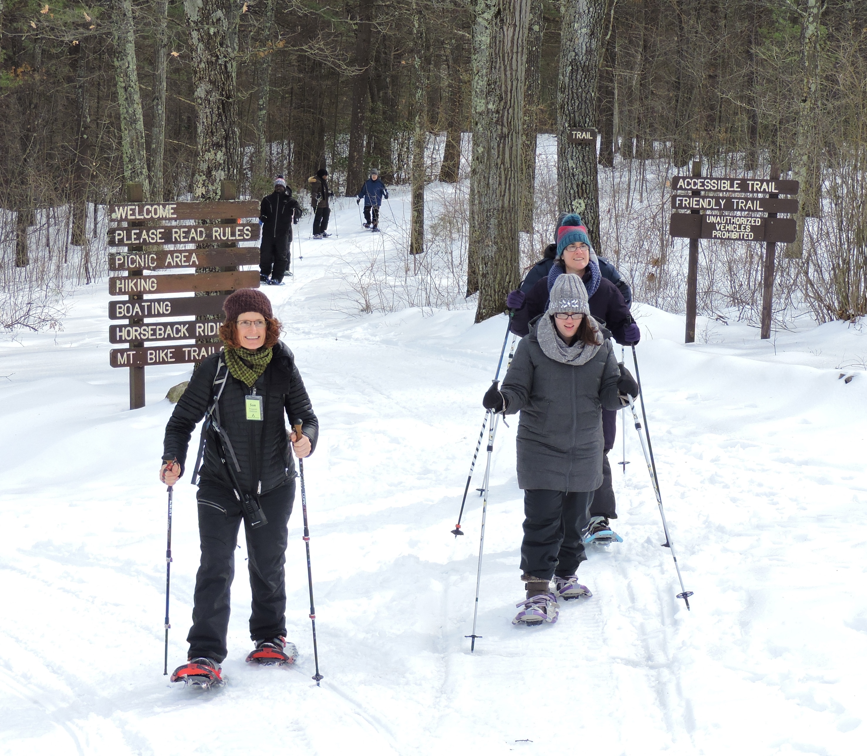 A group of snowshoers in the woods.