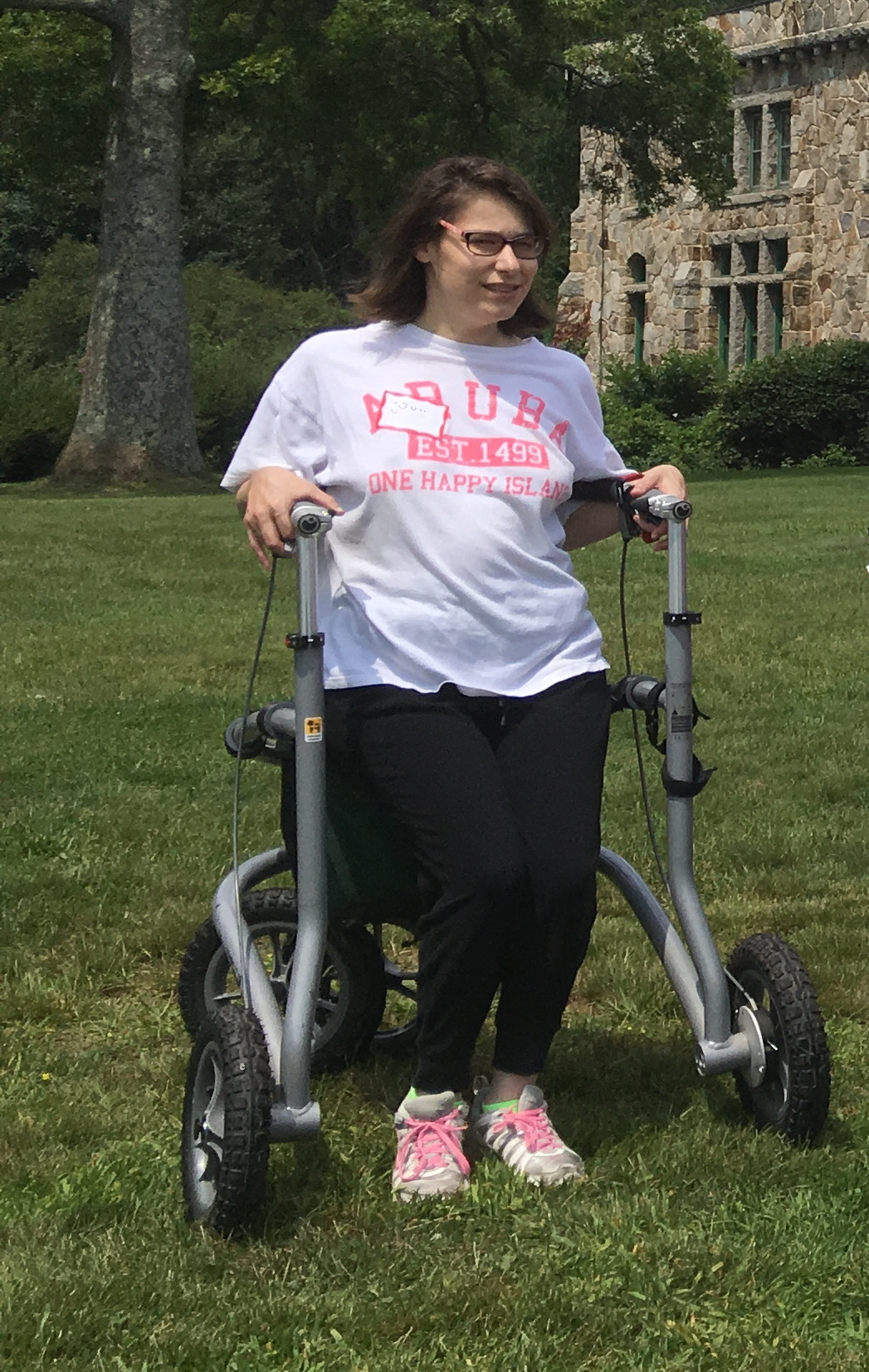 A hiker is sitting on the Veloped all-terrain walker.