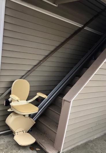 a chair lift attached to the outside of a home