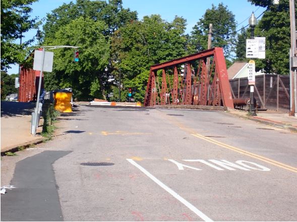 View of River Street Bridge from the side of the road. Looking west towards the River Street, Gordon Street, and Business Street intersection.