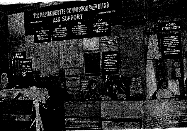 A photo of an exhibit in Boston in 1915 with three demonstrators who were blind