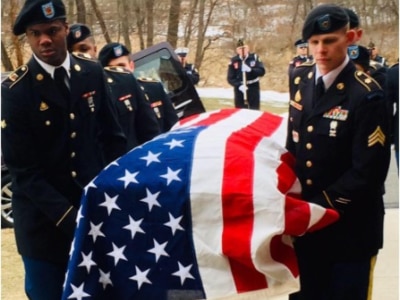 image of a casket with amarican flag draped over