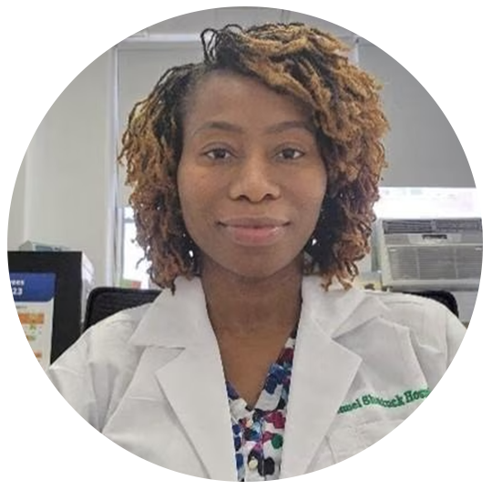 Seibatu Haidara is a nurse manager at Lemuel Shattuck Hospital. She has short curly hair. She wears a white lab coat in the hospital at work.