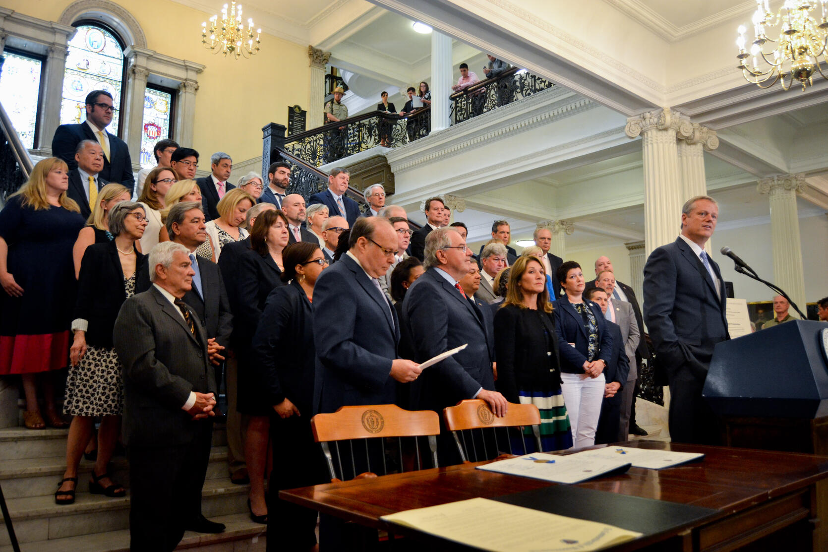 Governor Baker, Lt. Governor Polito, Speaker DeLeo, Senate President Rosenberg and legislators present resolution and proclamation.