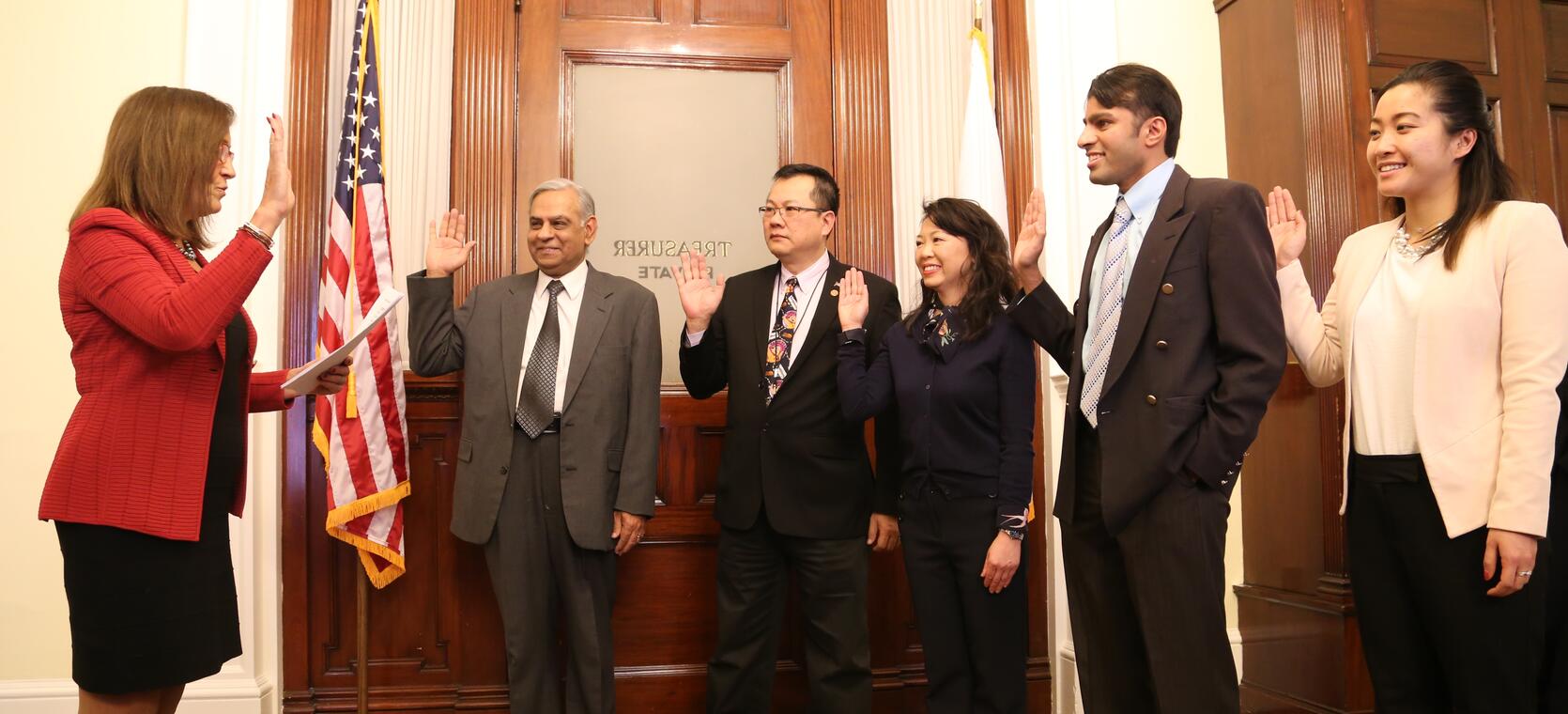 New members of the Asian American Commission were sworn in by State Treasurer Deborah Goldberg in her State House Office. The new commissioners, from left are: Anil Saigal, Gilbert Ho, Loan Dao, Janjy Ananth, and Nina Liang.