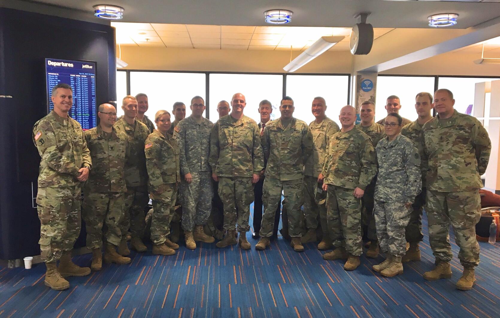 Soldiers from the 65th Press Camp Headquarters, Massachusetts Army National Guard depart Logan Airport for a relief mission to Puerto Rico