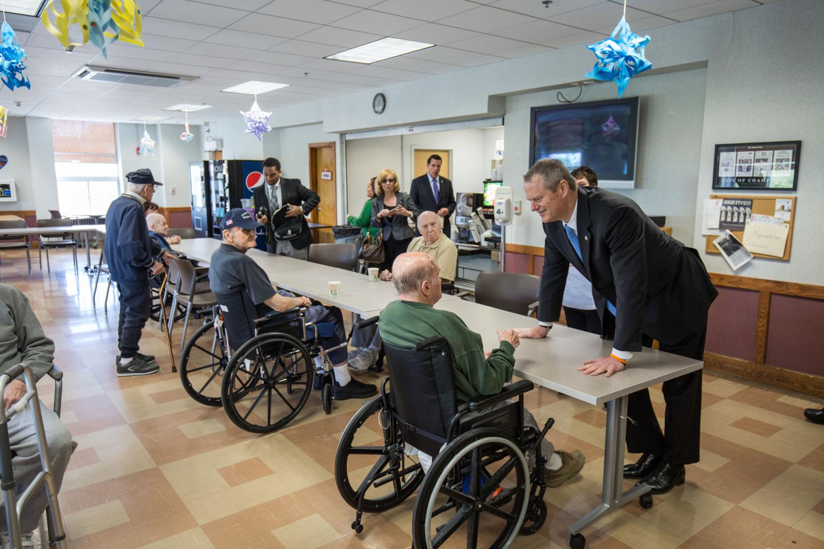 Governor Baker speaking with veterans at the Chelsea Soldiers' Home.