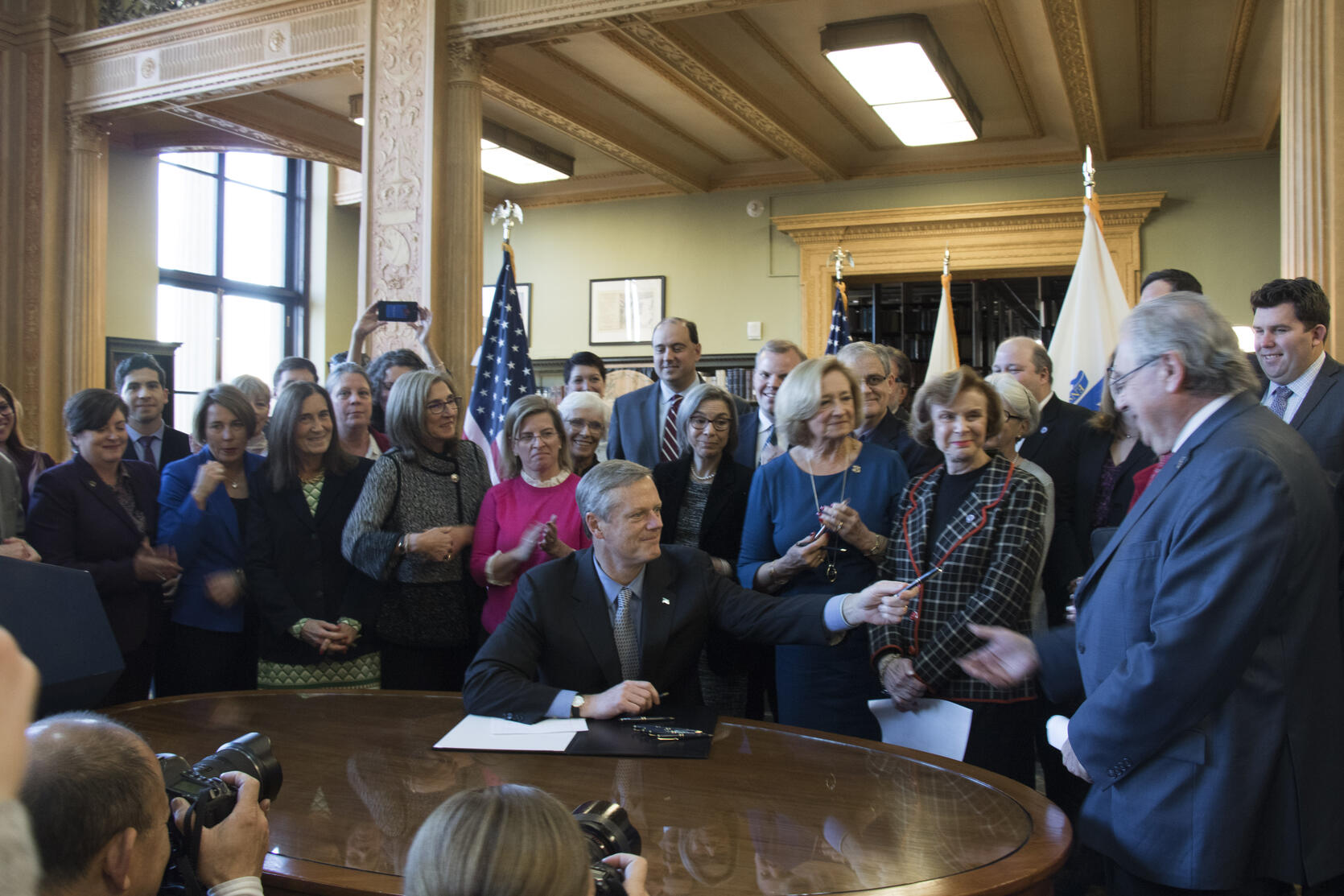Governor Baker signs the ACCESS legislation.
