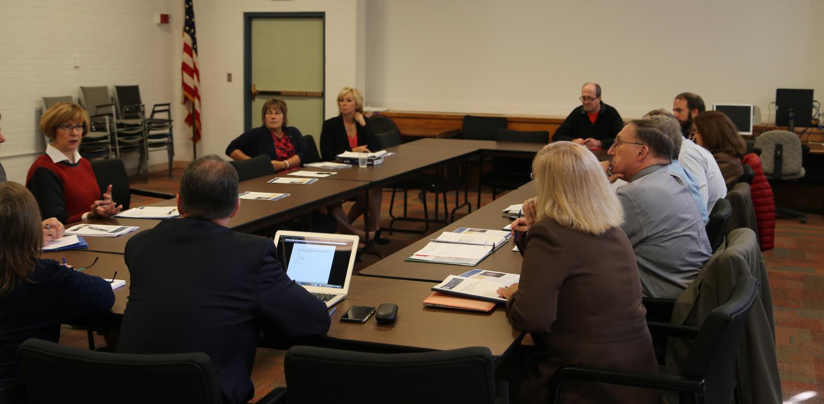 State Auditor Suzanne M. Bump (left) discusses the finding and recommendations contained in her office’s analysis of the Massachusetts regional school district structure with representatives from the Wachusett Regional School District.