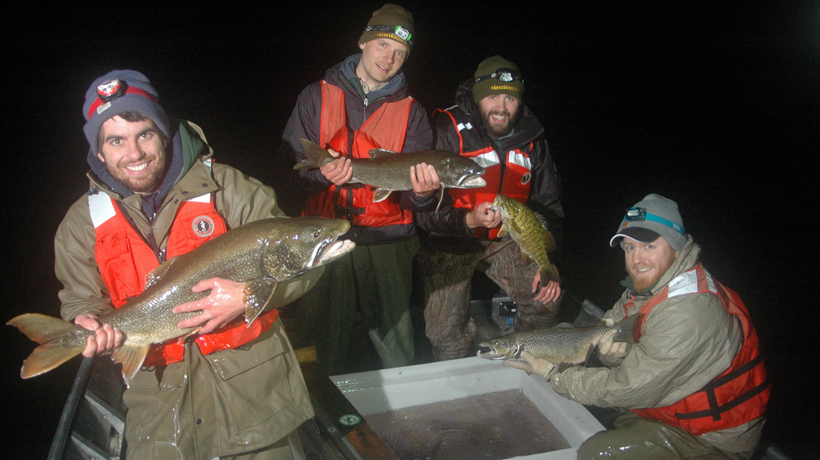 MassWildlife biologists holding fish during survey