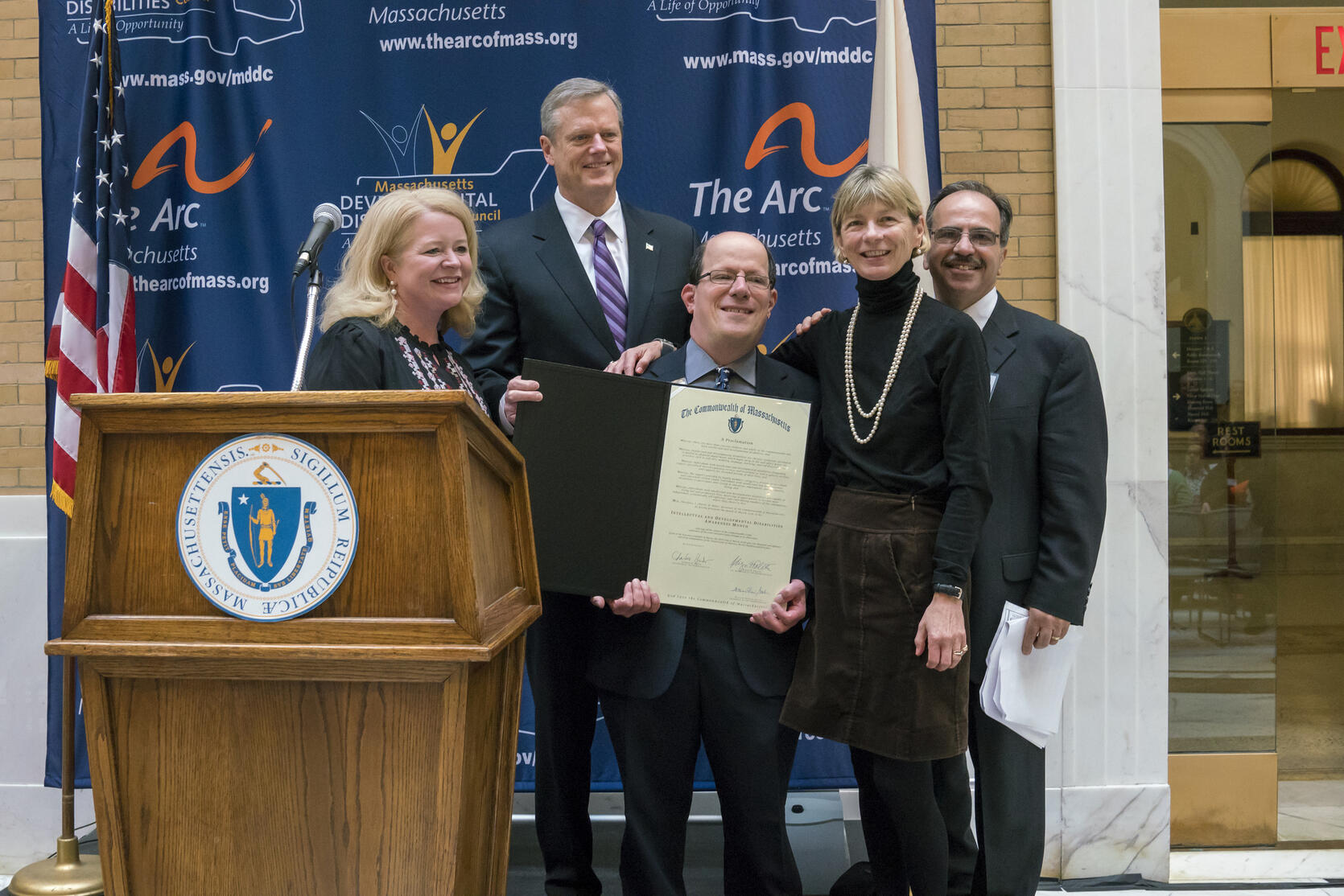 Governor Baker and HHS Secretary Sudders present proclamation.