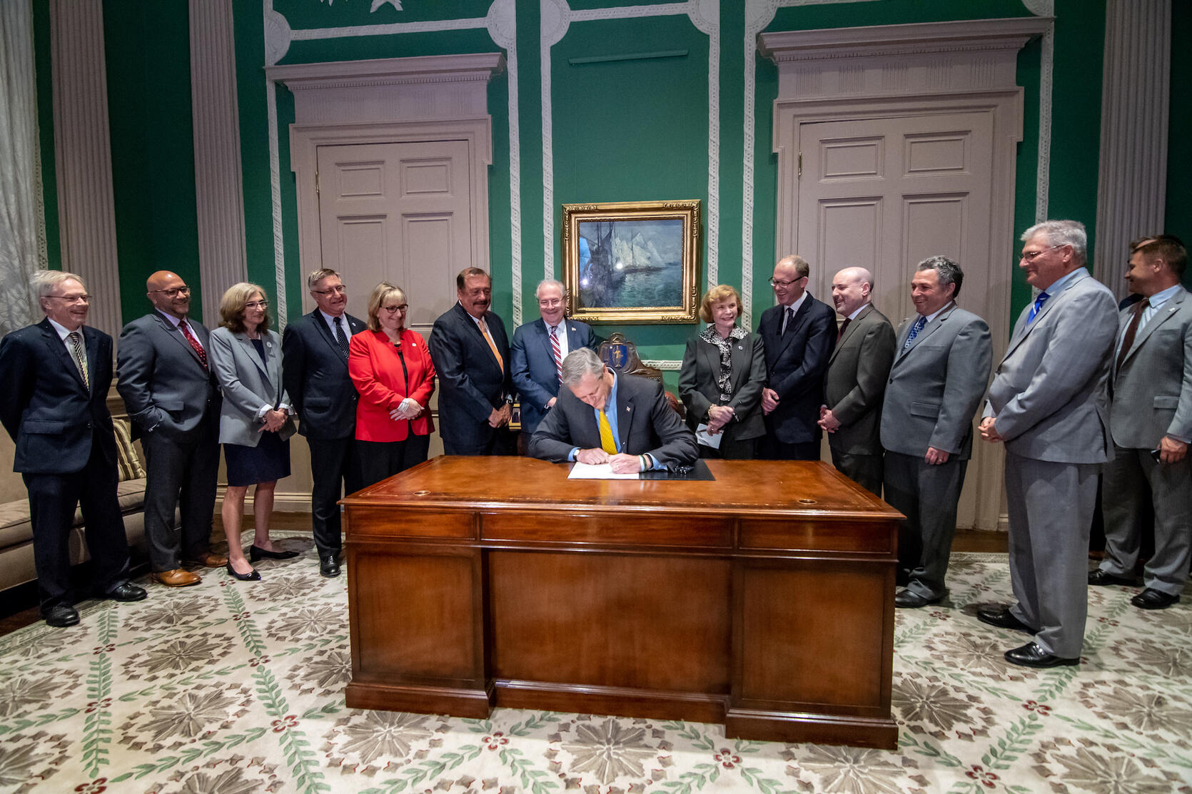 Governor Baker signs the grand bargain.