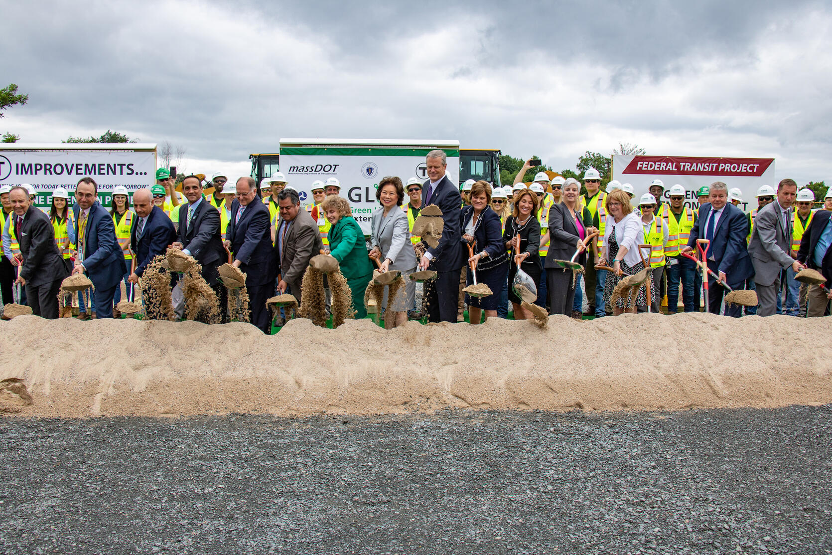 Governor Baker and numerous officials break ground on the Green Line Extension.
