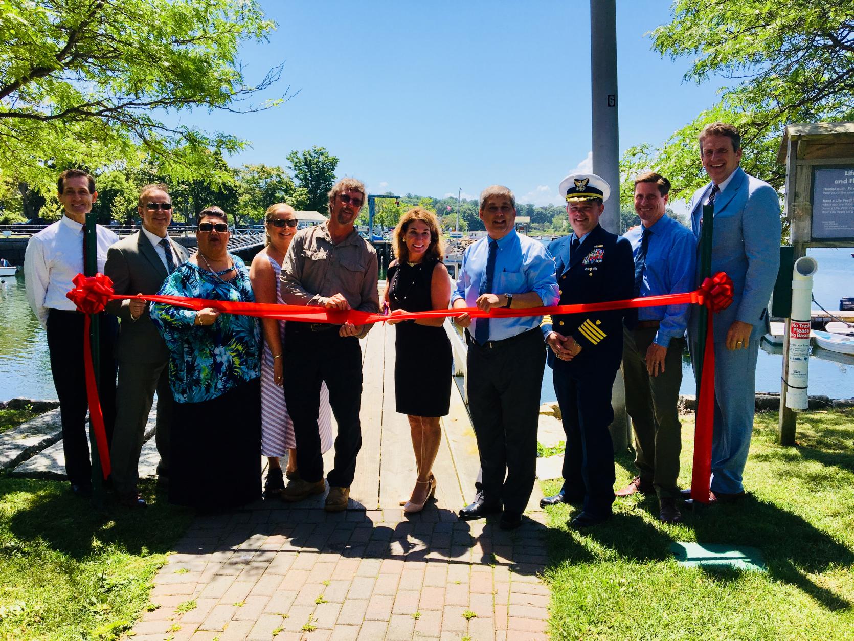 Lt. Governor Karyn Polito, center, and Housing and Economic Affairs Secretary Jay Ash, far right, attend the ribbon cutting for Manchester-by-the-Sea's dredging project.