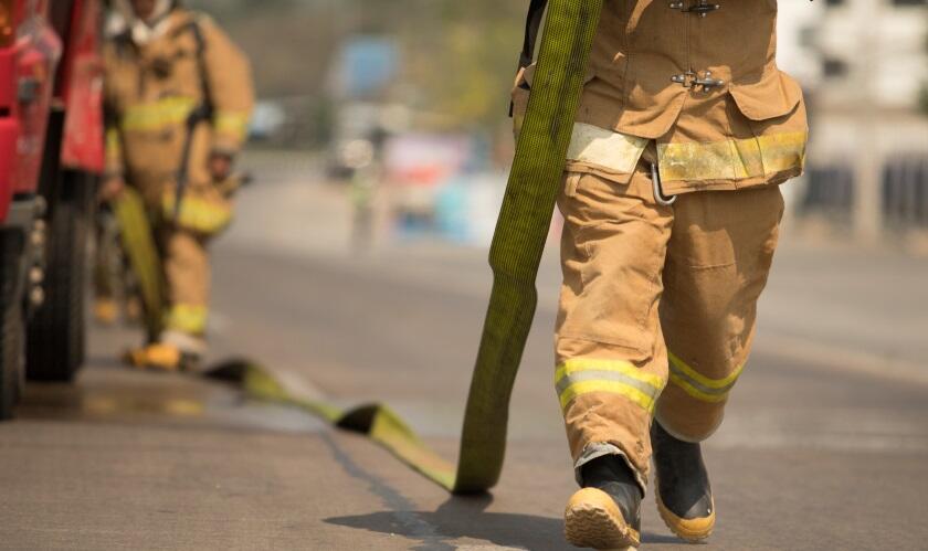 firefighter holding hose