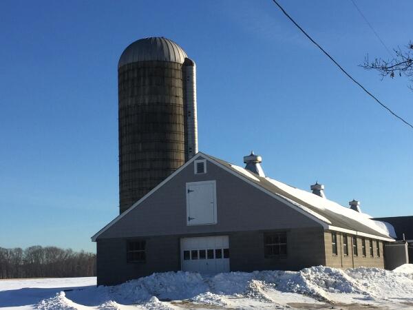 Photo of the barn and silo at Almeida Dairy Farm in Rehobeth, Massachusetts.