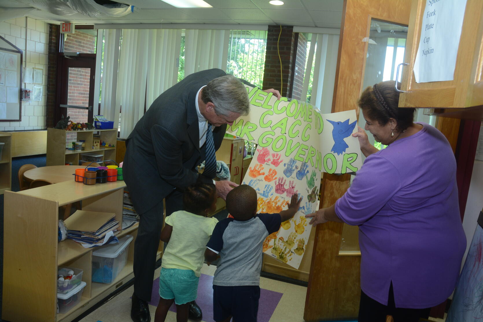 Photo of Governor Baker with children and teacher