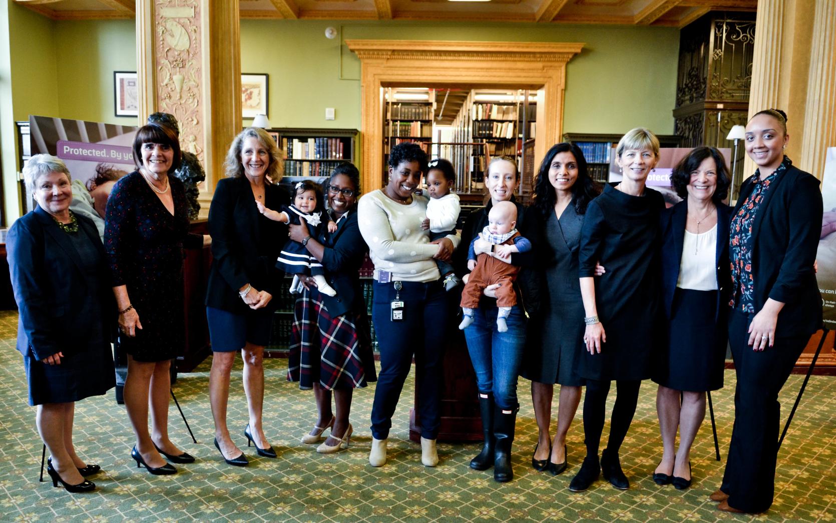 Photo from left to right: Maria Mossaides, Middlesex DA Marian Ryan, First Lady Lauren Baker, Sanouri (parent) and Avalyn (child), Shameakia (parent) and Cheyenne (child), Meg (parent) and Oscar (child), DCF Medical Director Dr. Linda Sagor and Doris Decoo (photo by Lucyus Fevrier)