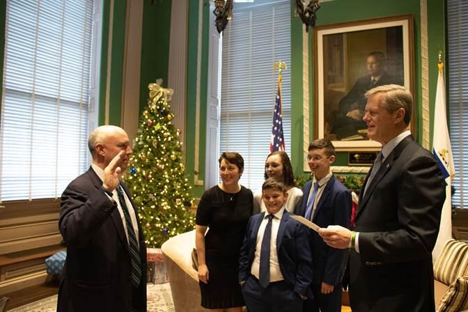 Governor Charlie Baker swears in Secretary Mike Kennealy.