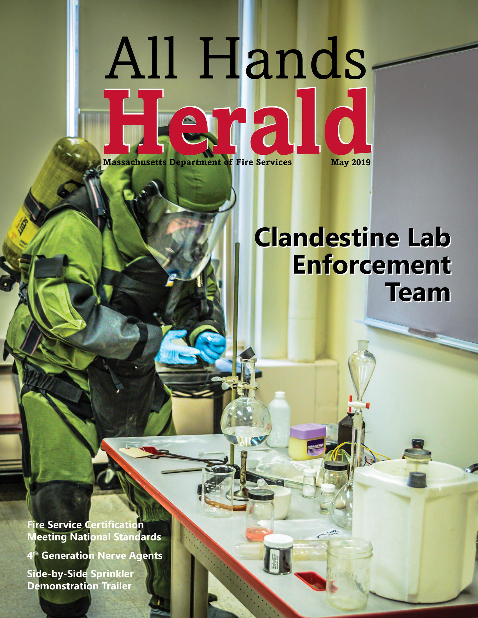 Cover of May 2019 All Hands Herald shows member of CLET in protective gear