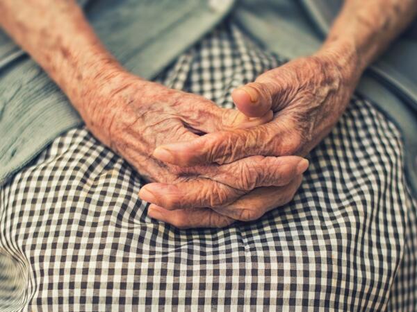 An imagea of an elderly person's hands. 