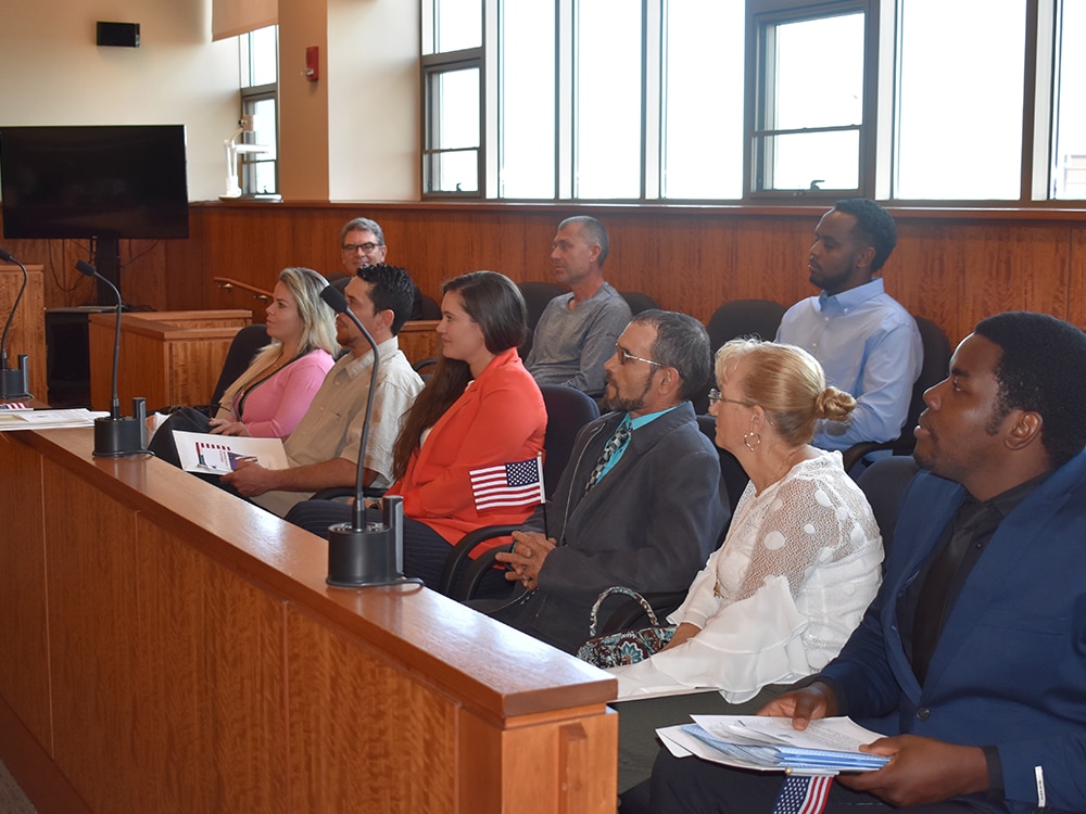 New Americans are sworn in at the Fall River Justice Center.
