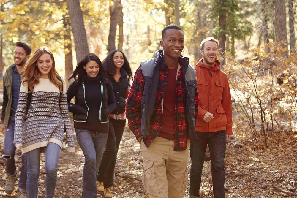 young group hiking in fall