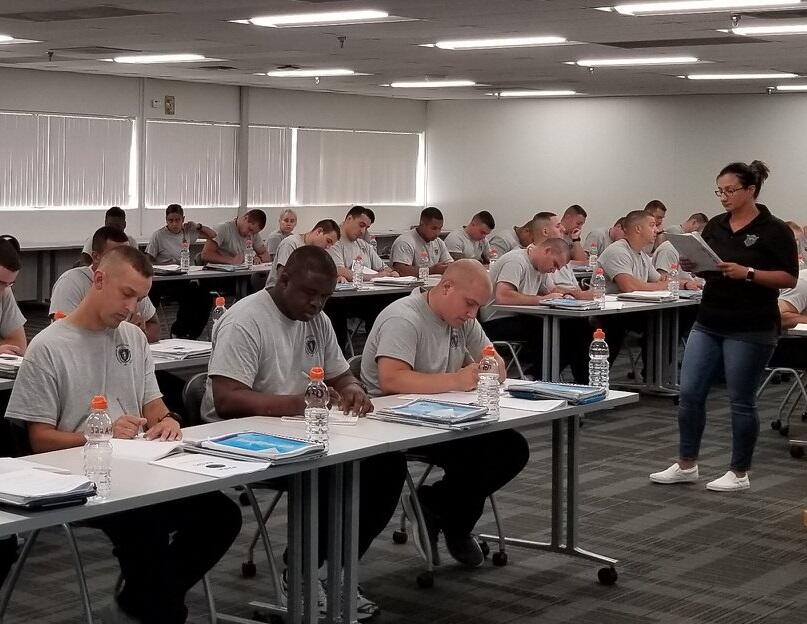 Correction officers in a classroom