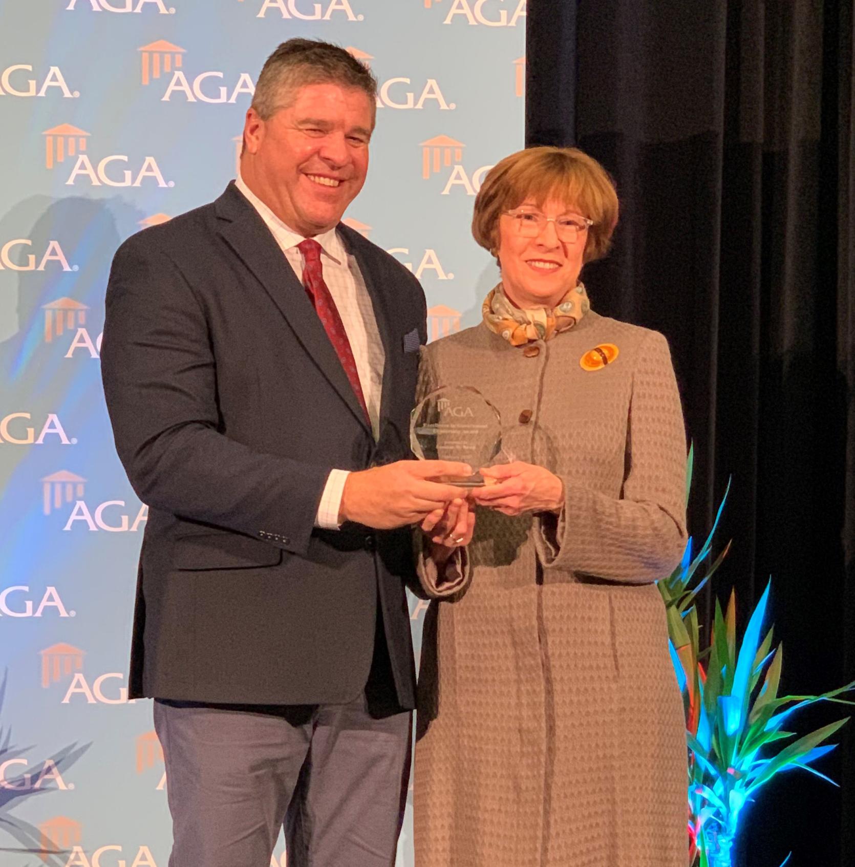 Auditor Bump receives the 2020 Excellence in Government Leadership Award from AGA President Ernie Almonte.