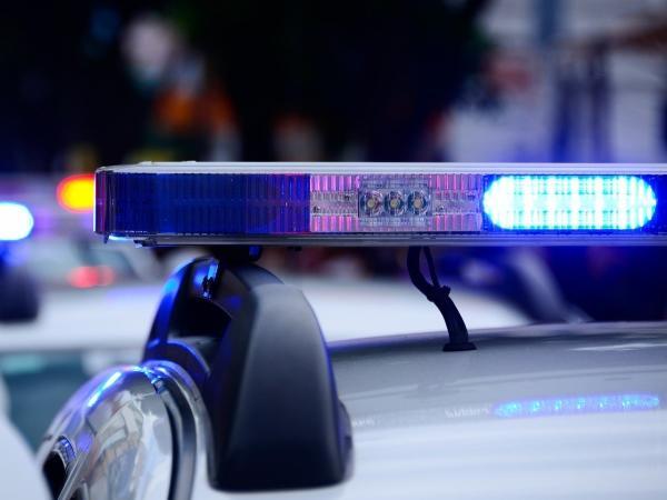 Blue flashing lights on the top of a police car