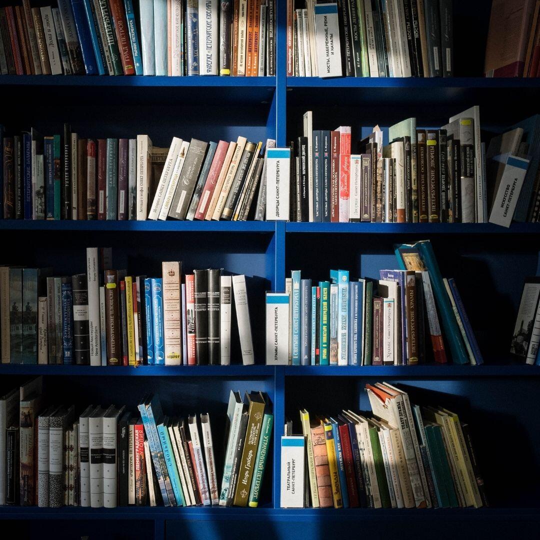 Image of rows of books similar to rows of accessible learning materials found on shelves in AIM warehouse