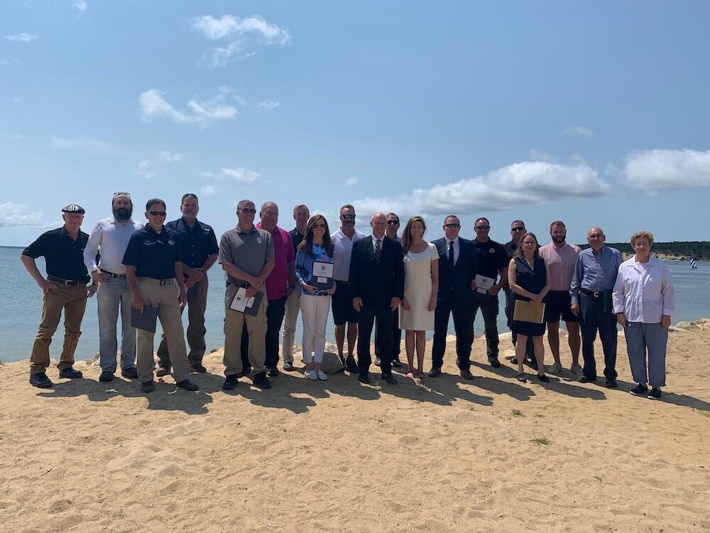 Secretary Kennealy with dredging grant recipients. 