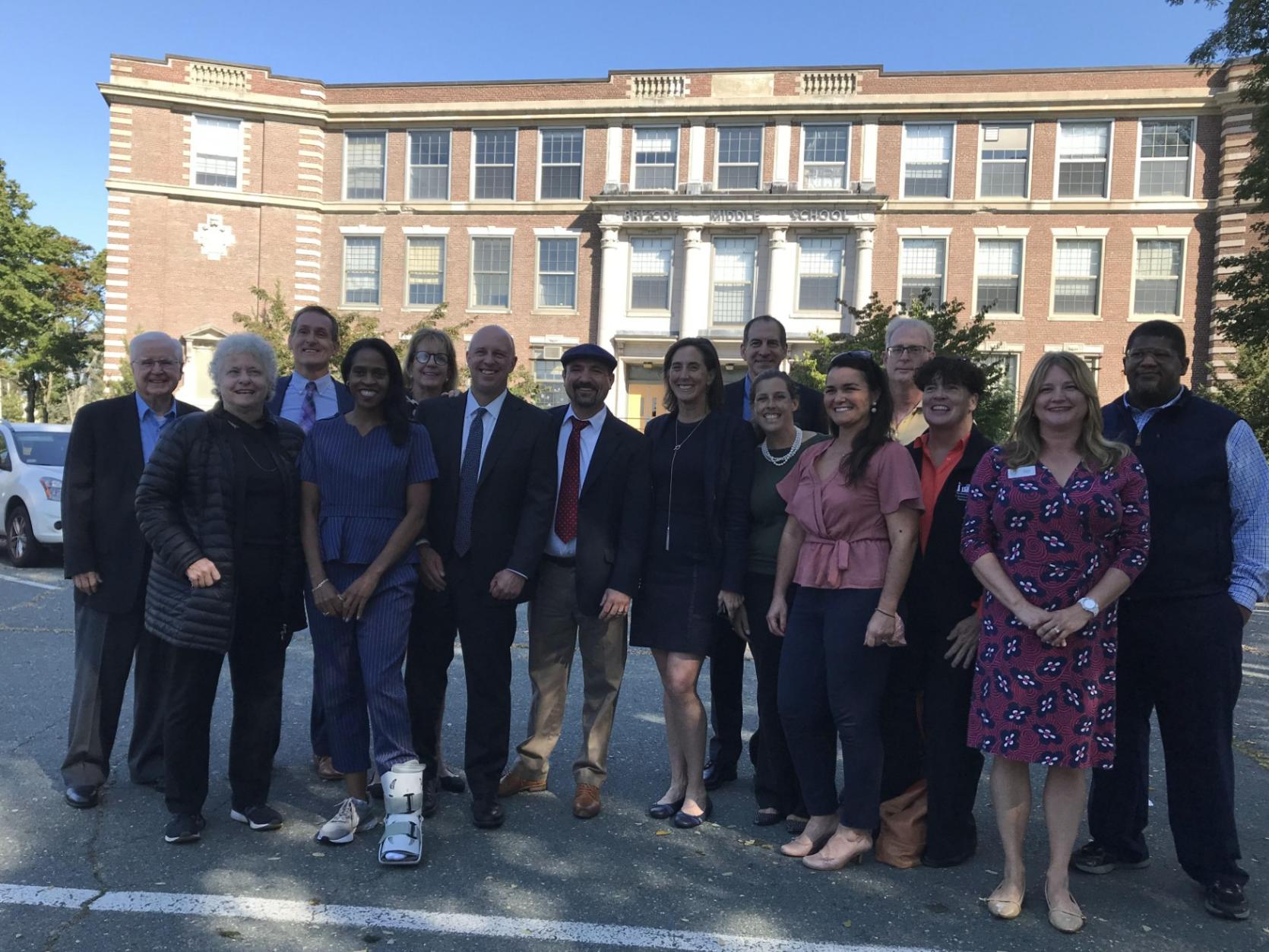 Secretary Kennealy and Undersecretary Maddox with local officials, developers, housing advocates, and others at the Briscoe School in Beverly.