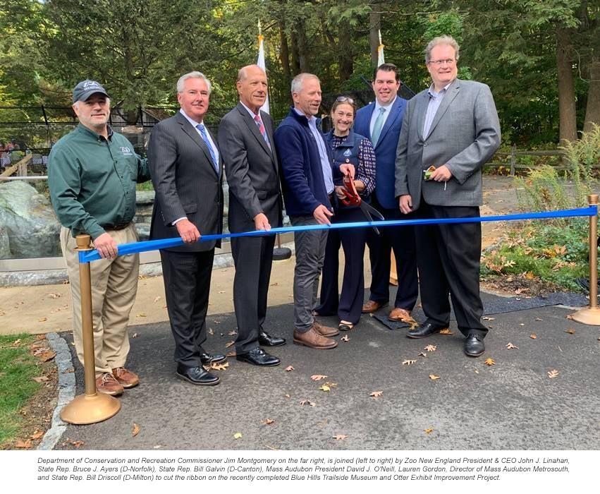 Department of Conservation and Recreation Commissioner Jim Montgomery on the far right, is joined (left to right) by Zoo New England President & CEO John J. Linahan, State Rep. Bruce J. Ayers (D-Norfolk), State Rep. Bill Galvin (D-Canton), Mass Audubon President David J. O'Neill, Lauren Gordon, Director of Mass Audubon Metrosouth, and State Rep. Bill Driscoll (D-Milton) to cut the ribbon on the recently completed Blue Hills Trailside Museum and Otter Exhibit Improvement Project.