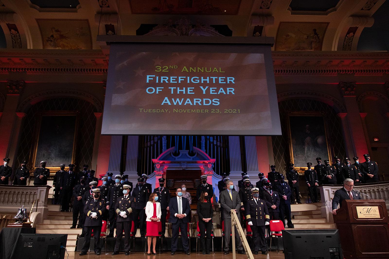 Firefighters and public officials at an award ceremony