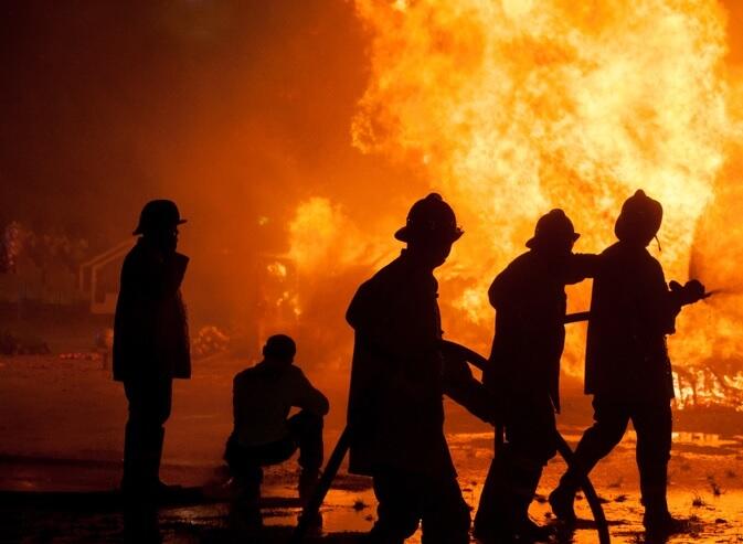 firefighters silhouette at night