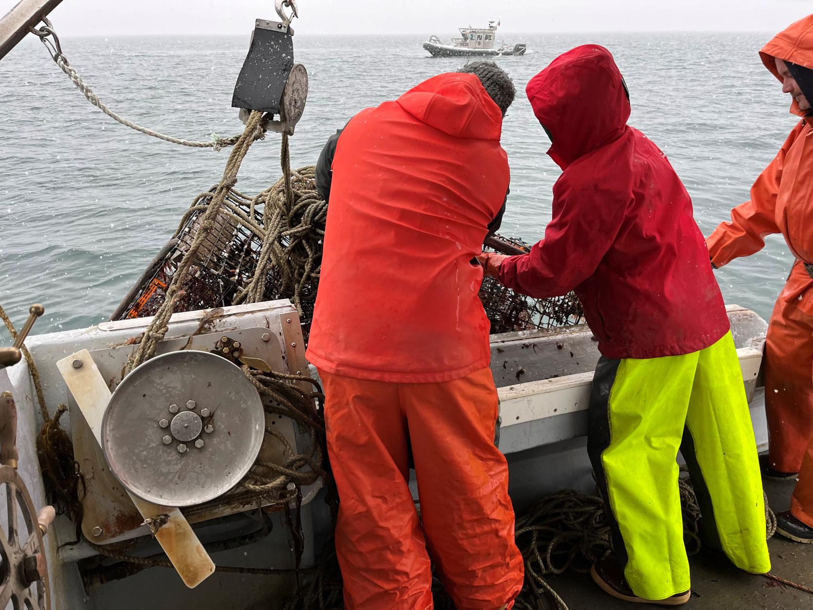 Fishermen retrieving derelict gear