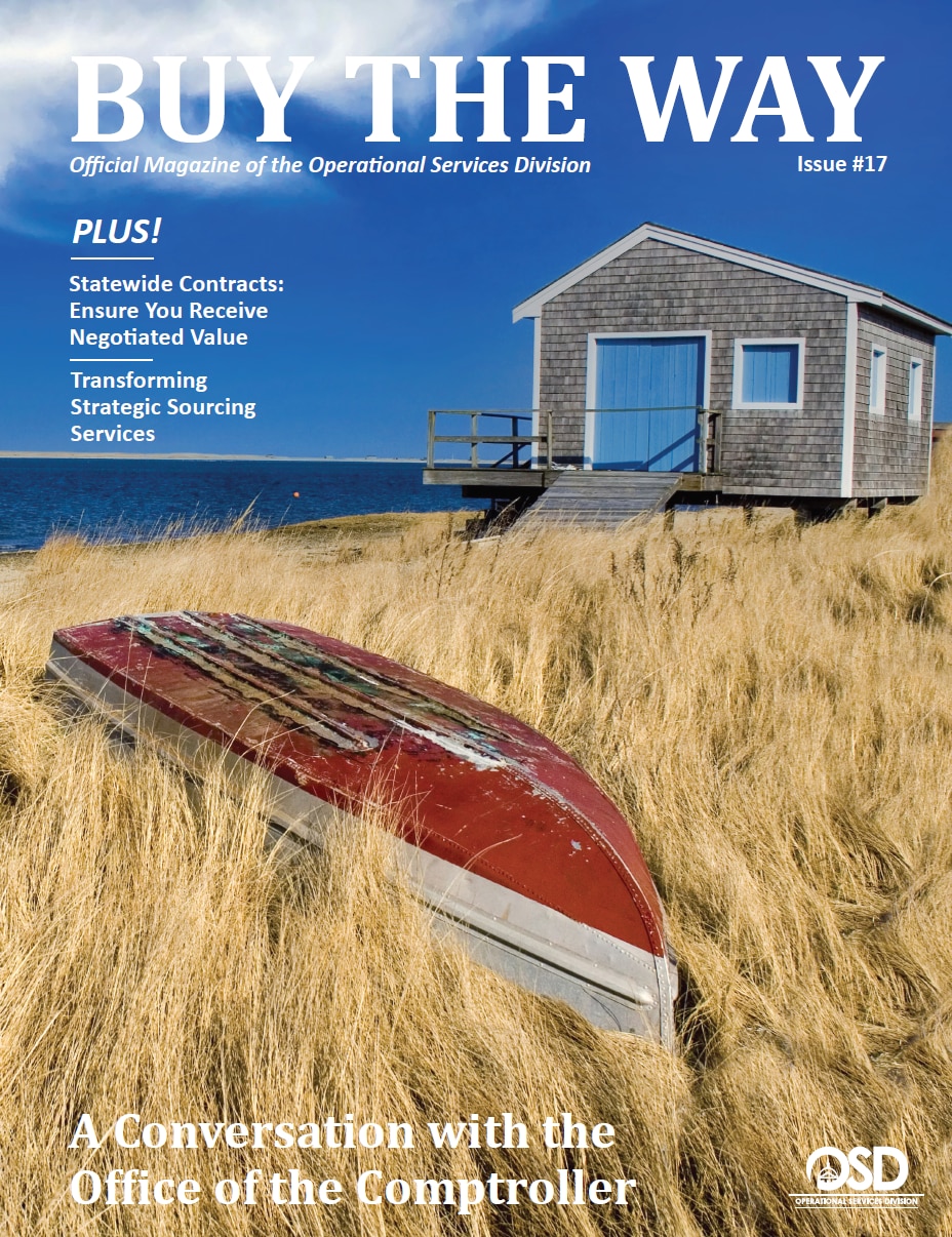 Buy the Way issue 17 Cover: Red upside down rowboat in tan beach grass with a small beach house and ocean in the distance. 